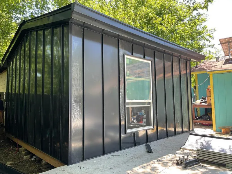 Black standing seam metal wall panels for Roof Inspection in Smithfield